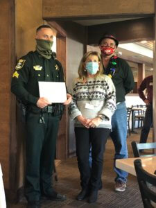 Sergeant James Bates receives his deputy of the month award from the FMB Chamber.