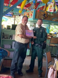 Kyle Hargis receives his Deputy of the Month award from the FMB Chamber.