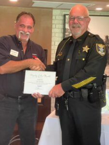 Deputy Ed Waite receives his award from Chamber Chairman John Gavin.