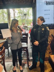 Deputy Katherine Strange receives her deputy of the month award from Jacki Liszak.