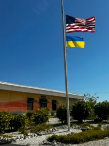 The Ukraine Flag flies beneath the stars and stripes at Fort Myers Beach Town Hall.
