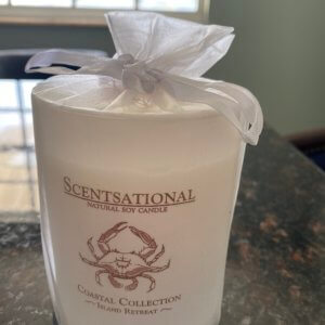 A soy candle with Island Retreat scent.