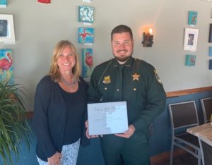 FMB Chamber President Jacki Liszak with Lee County Sheriff Deputy Joe Clark 