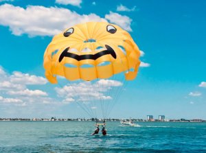 Two flyers enjoy a ride with Paradise Parasail.