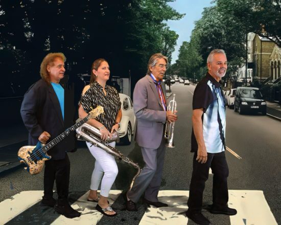 Four musicians with instruments pose walking across a crosswalk, mimicking the Beatles’ Abbey Road album cover.