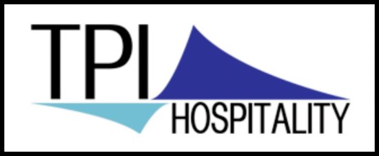 TPI TPI Hospitality logo with bold text and two blue triangular sail‑like shapes above and below.